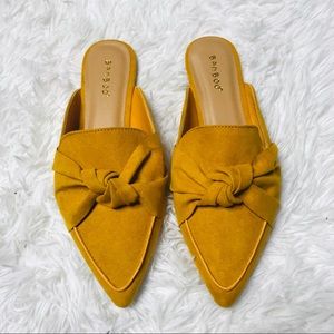 New Mustard bow front mules size 8